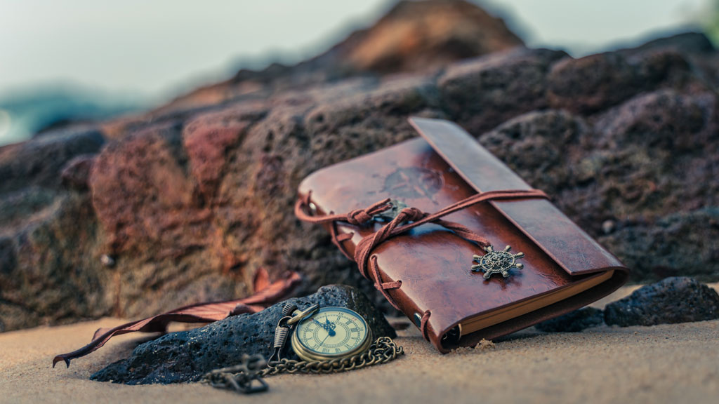 shutterstock_1690906876 compass notebook
